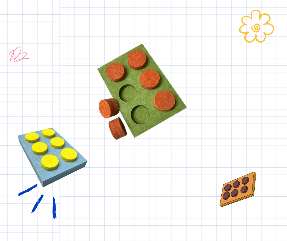 The TactoNum pad: a green felt tablet with six round wells holding removable orange discs, beside a blue base board.
