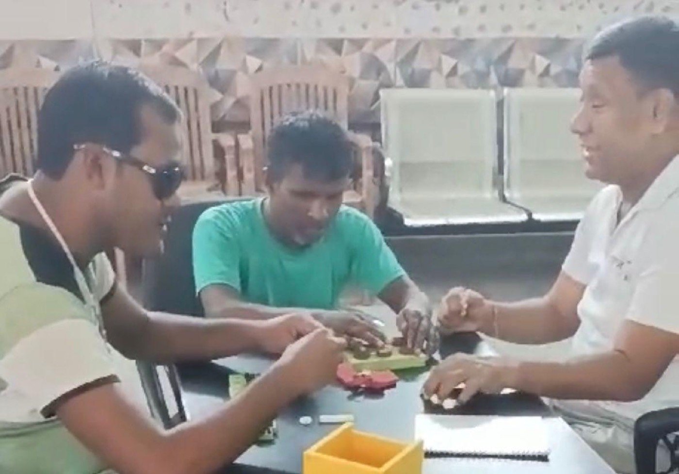 A student&rsquo;s hands moving across the Math Kit&rsquo;s Braille number tiles, counting the raised dots on each one.